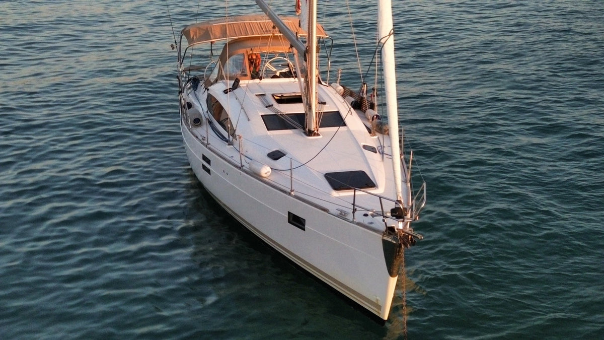 Aerial view of the sailing yacht at anchor in calm water